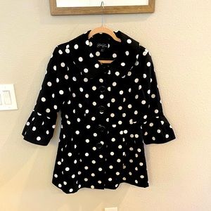 Black swing coat with white polka dots